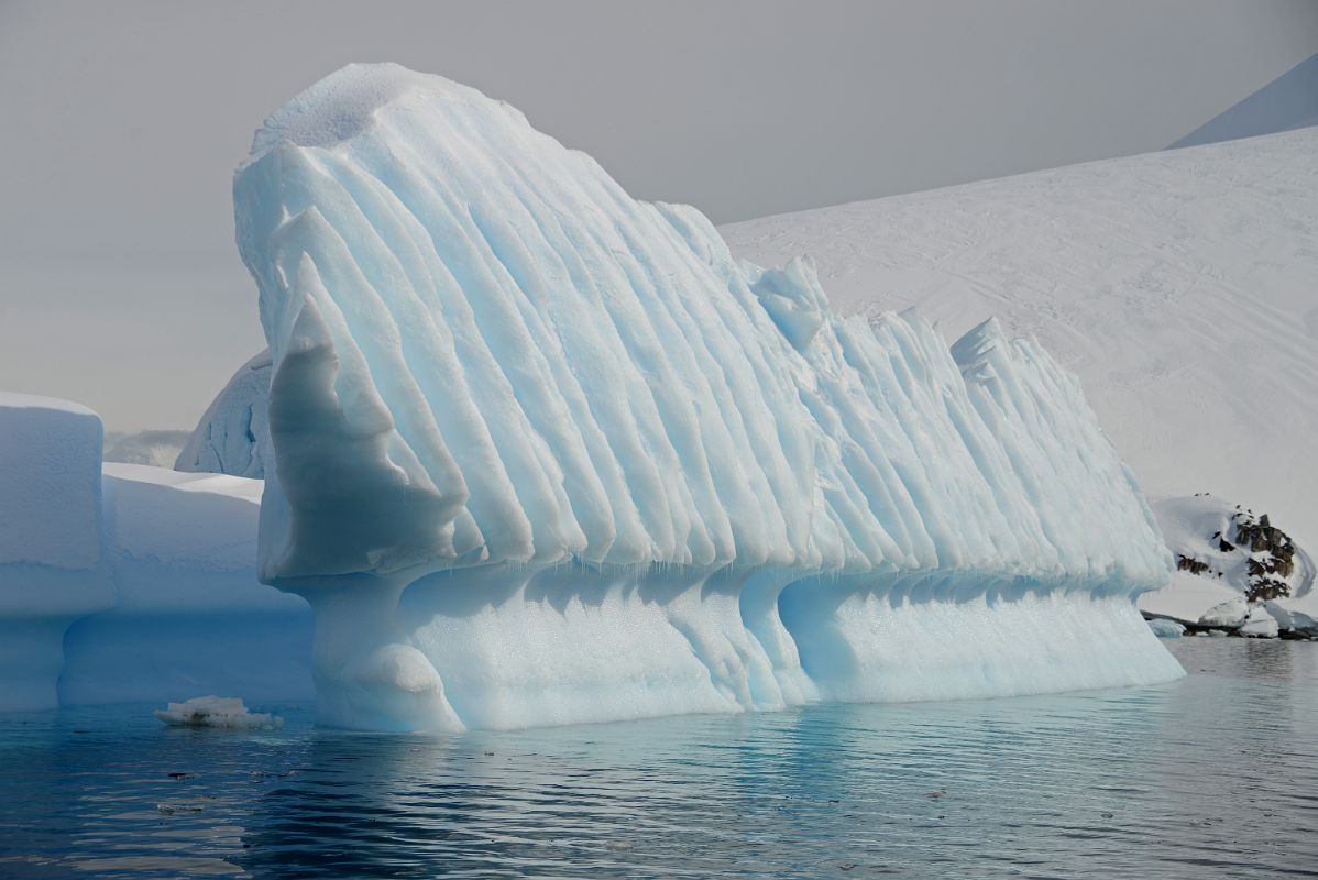 15E Iceberg Shaped Like A Pipe Organ Next To Cuverville Island From Zodiac On Quark Expeditions Antarctica Cruise